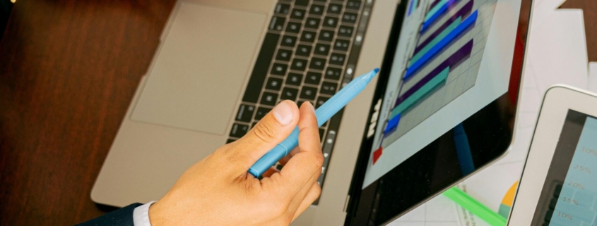 Free A Person in Black Suit Holding a Pen Stock Photo